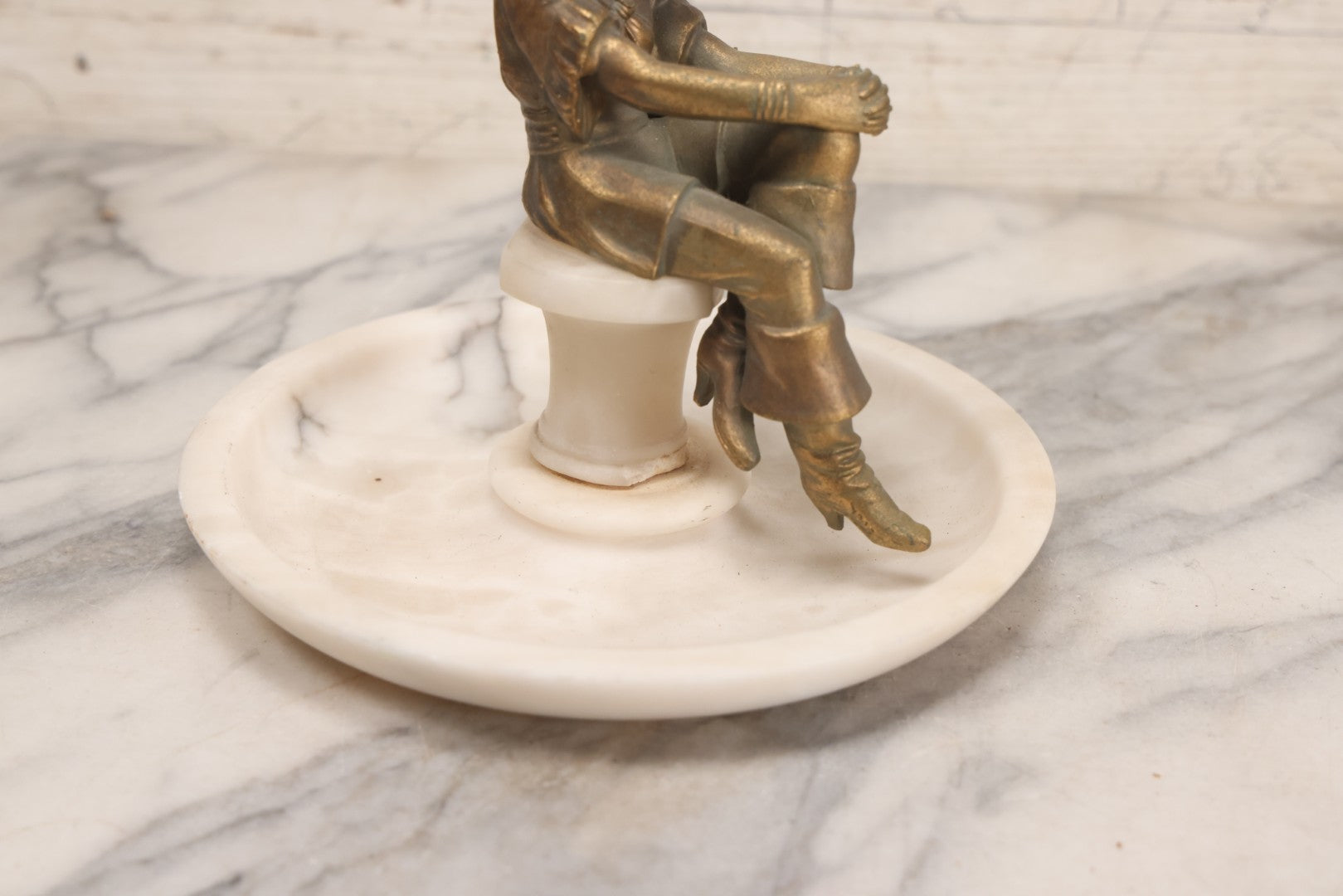 Lot 082 - Antique Alabaster Ashtray With Metal Female Pirate Figure Seated On Pedestal, Note Loss To Pedestal Base, Loosening Bolt