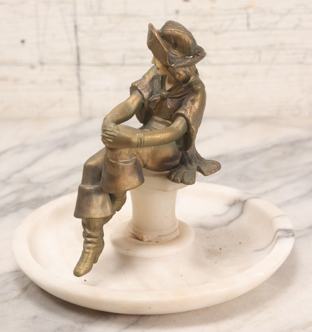 Lot 082 - Antique Alabaster Ashtray With Metal Female Pirate Figure Seated On Pedestal, Note Loss To Pedestal Base, Loosening Bolt
