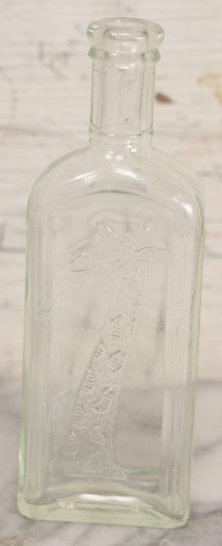 Lot 085 - Antique Tonsiline Glass Medicine Bottle With Embossed Giraffe