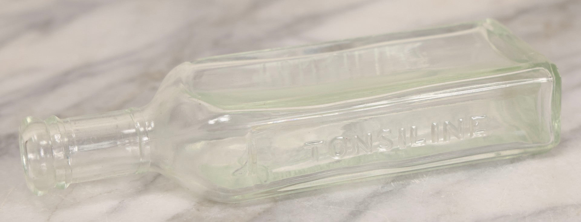 Lot 085 - Antique Tonsiline Glass Medicine Bottle With Embossed Giraffe