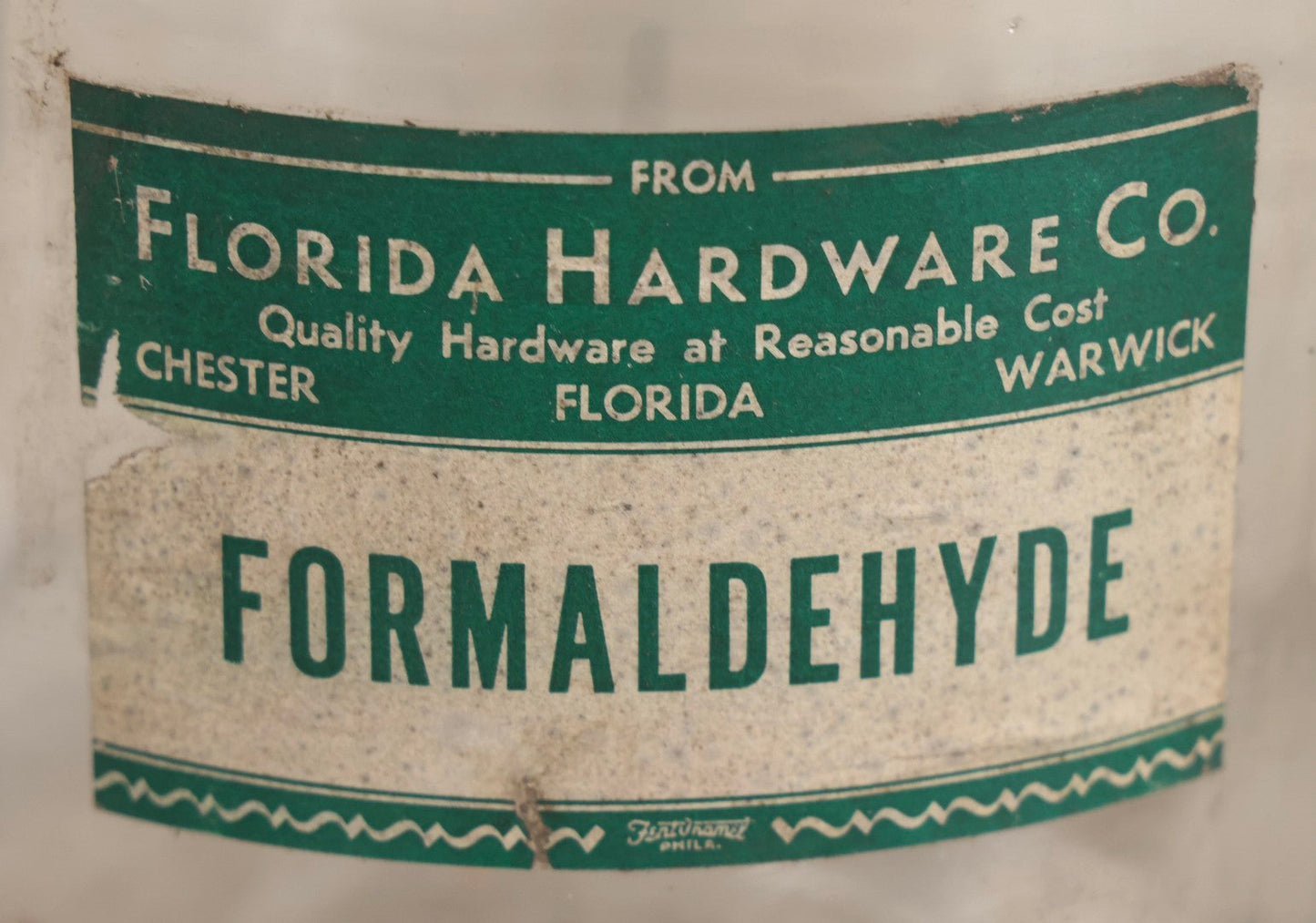 Lot 087 - Pair Of Vintage Clear Glass Jugs With Later-Applied Green “Formaldehyde” Paper Labels From Florida Hardware Co.