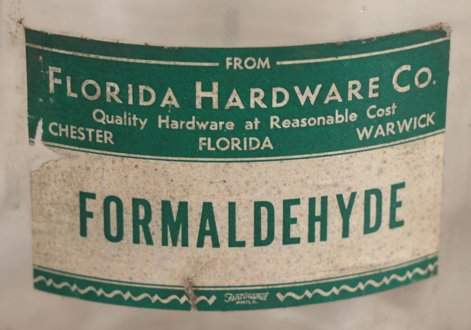 Lot 087 - Pair Of Vintage Clear Glass Jugs With Later-Applied Green “Formaldehyde” Paper Labels From Florida Hardware Co.