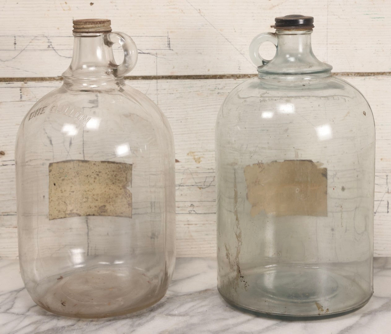 Lot 087 - Pair Of Vintage Clear Glass Jugs With Later-Applied Green “Formaldehyde” Paper Labels From Florida Hardware Co.