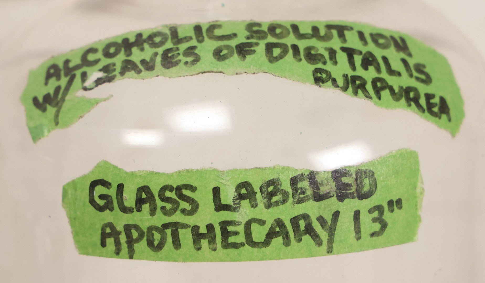 Lot 090 - Trio Of Antique Apothecary Glass Bottles With Ground Stoppers, Mixed Sizes, Worn And Partially Detached Labels, Residue And Staining, Poor As-Found Condition