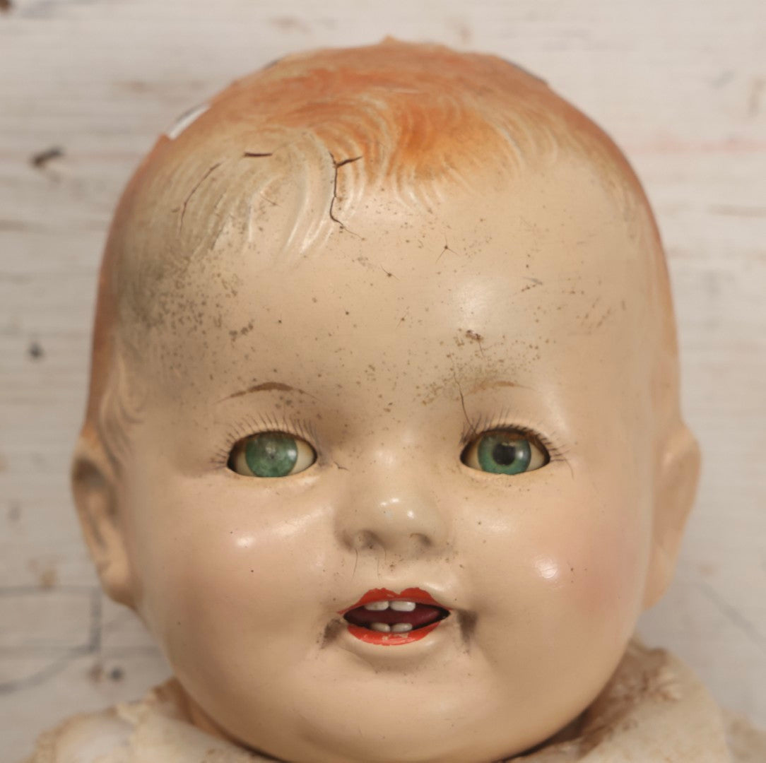 Lot 091 - Vintage Composition Baby Doll With Blue Sleep Eyes, Red Hair, And Original Outfit