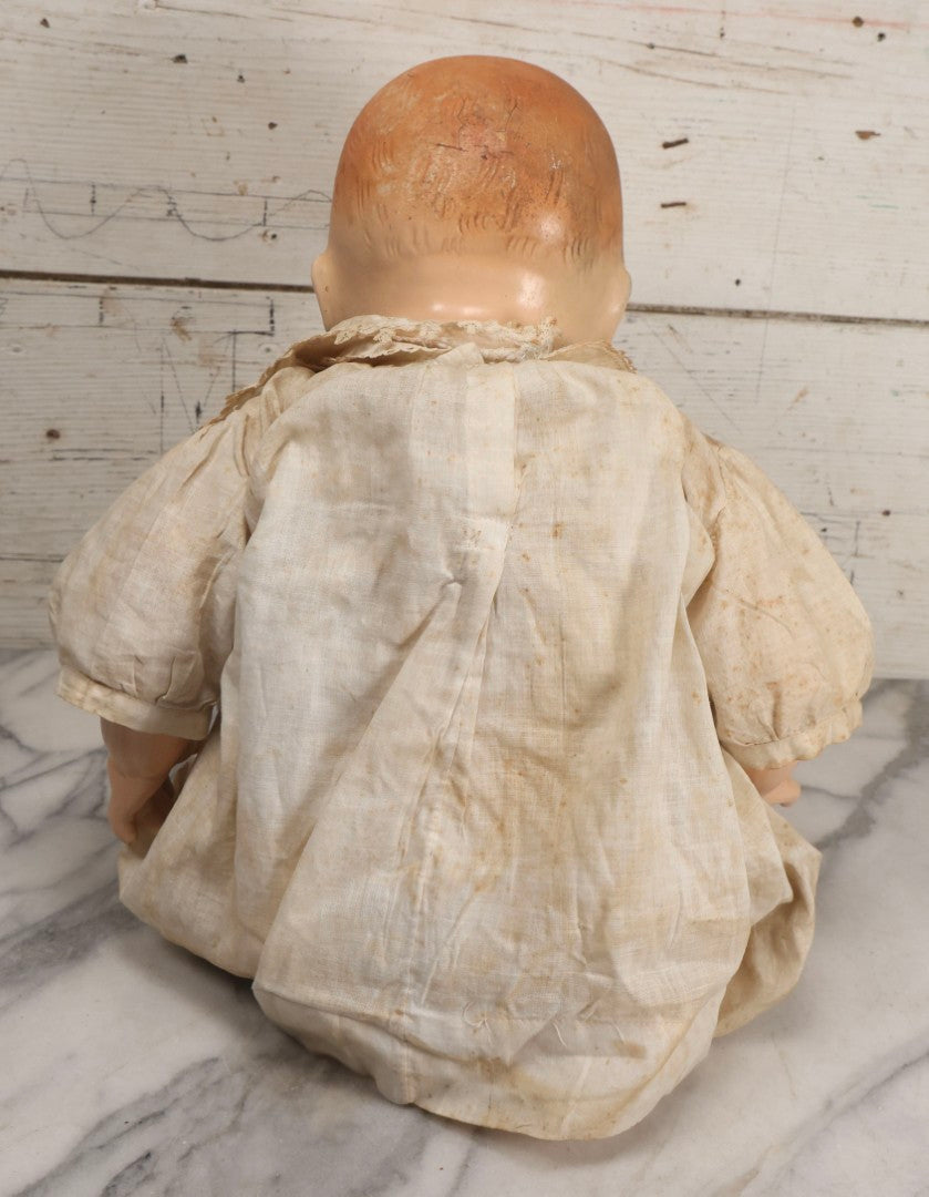 Lot 091 - Vintage Composition Baby Doll With Blue Sleep Eyes, Red Hair, And Original Outfit