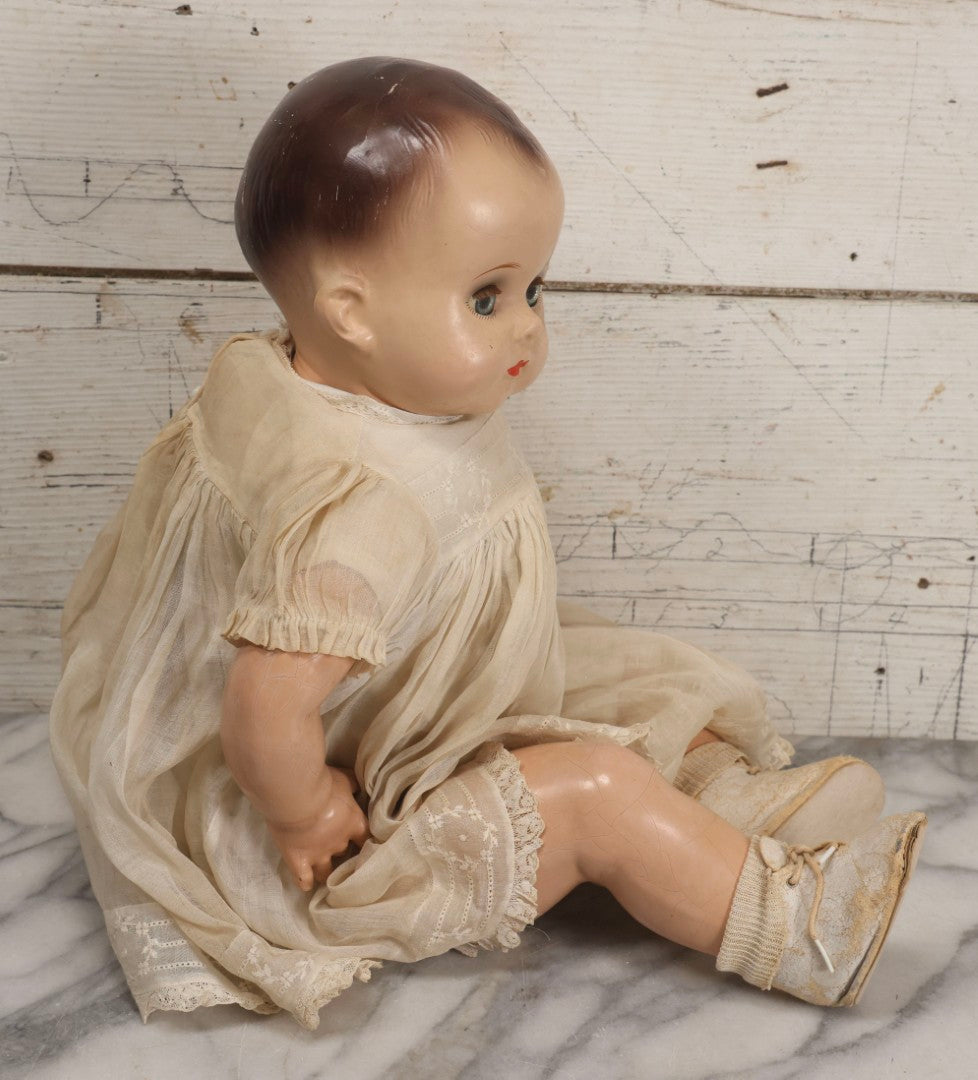 Lot 092 - Vintage Composition Baby Doll With Blue Sleep Eyes, Brown Hair, And Original Outfit