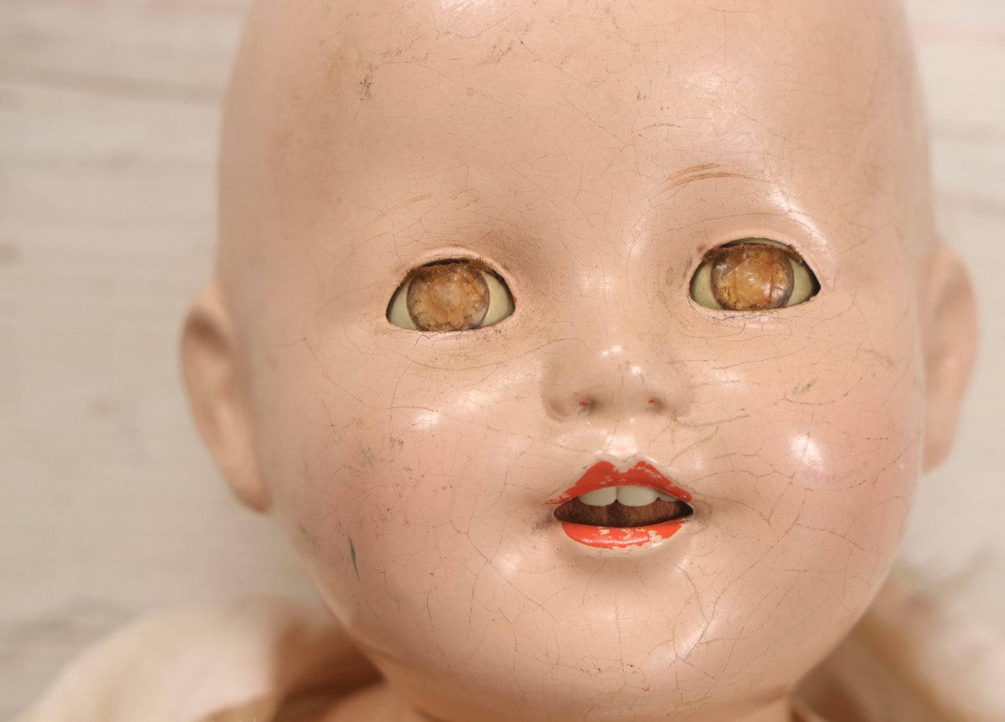 Lot 093 - Vintage Composition Baby Doll With Yellowed Sleep Eyes And Original Outfit, Missing Wig, Damaged Foot