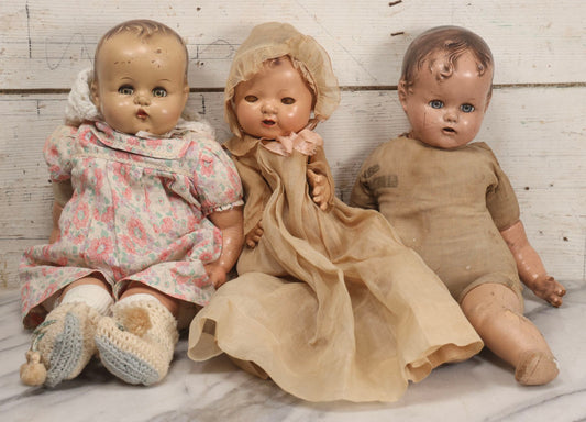 Lot 094 - Trio Of Vintage Composition Baby Dolls Including Floral Dress, Sheer Gown With Bonnet, And Plain Tan Undergarment