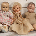 Lot 094 - Trio Of Vintage Composition Baby Dolls Including Floral Dress, Sheer Gown With Bonnet, And Plain Tan Undergarment