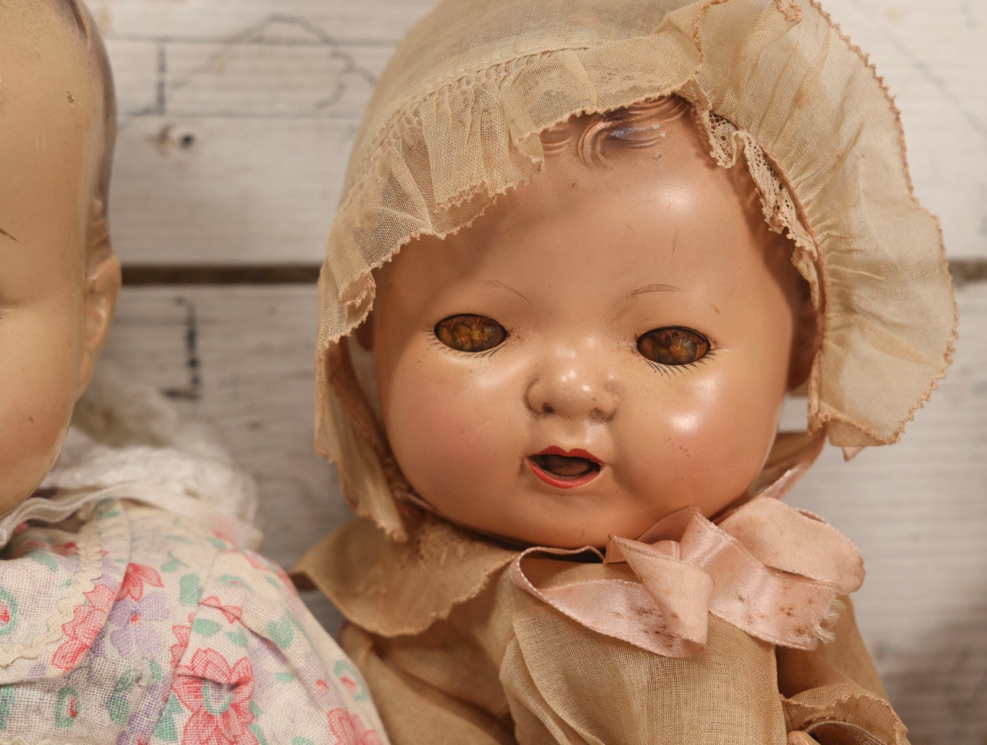 Lot 094 - Trio Of Vintage Composition Baby Dolls Including Floral Dress, Sheer Gown With Bonnet, And Plain Tan Undergarment