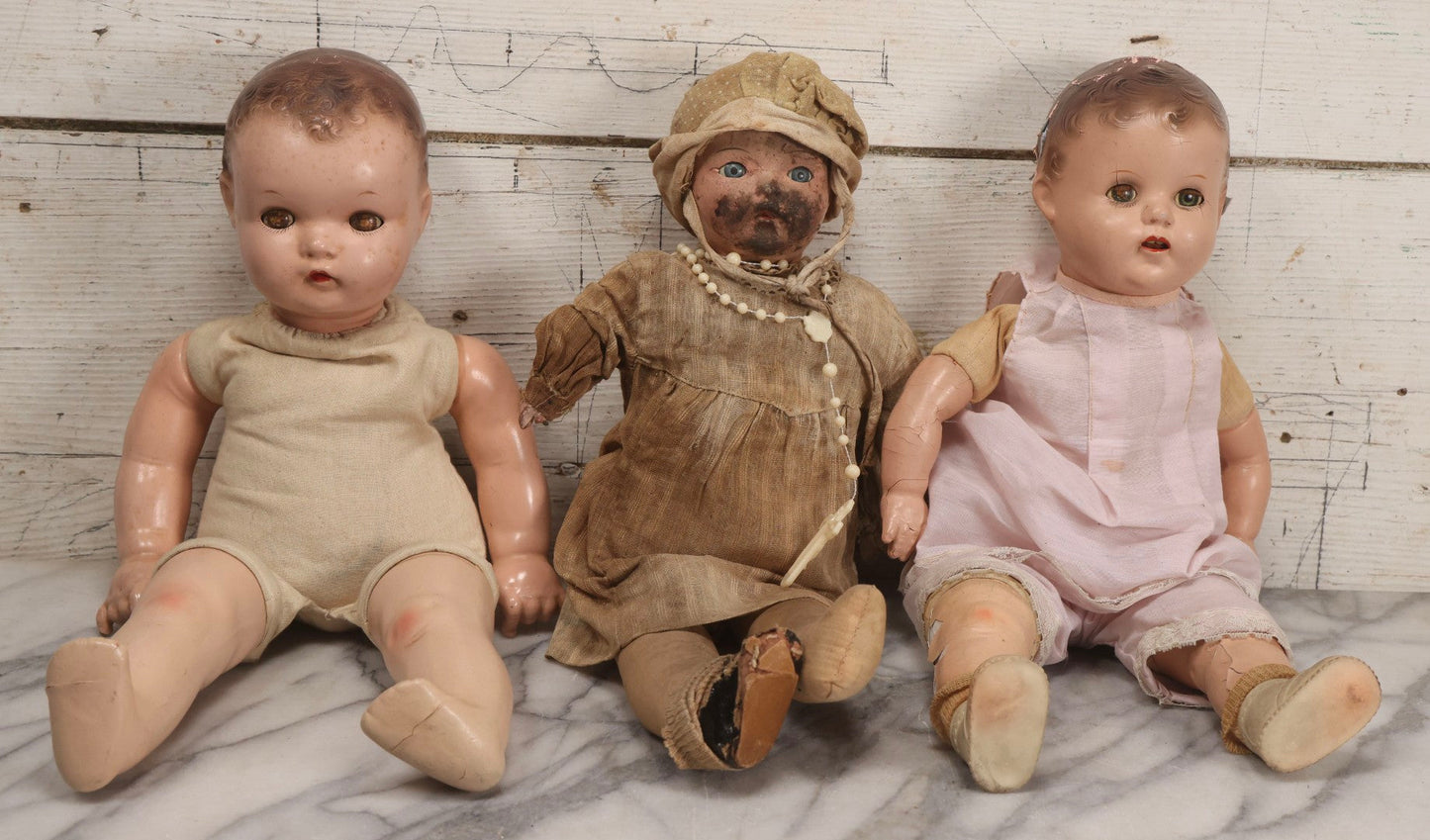 Lot 095 - Trio Of Vintage Composition Baby Dolls Including Pink Dress With Lace Trim, Dirty Dress With Beads, And Sleeveless Undergarment