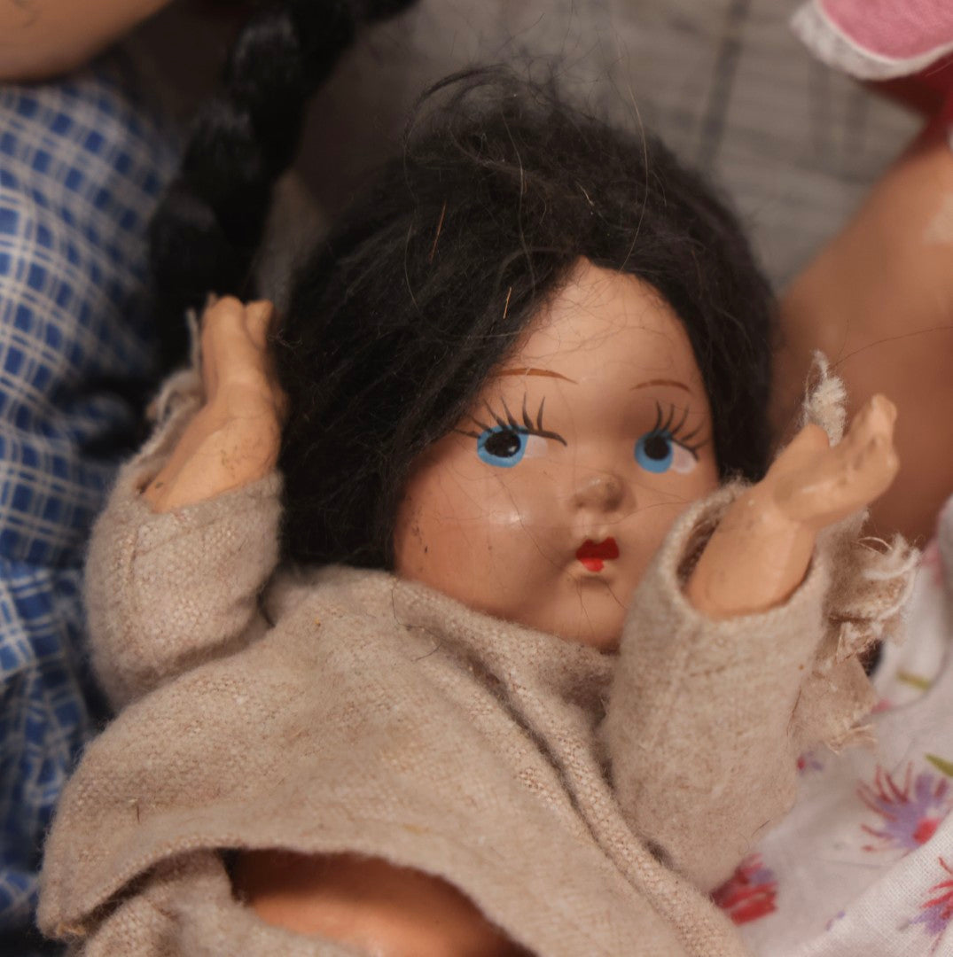 Lot 096 - Grouping Of Five Vintage Composition Dolls Including Floral Dress Doll, Plaid Dress Doll, Blue Check Dress Doll With Bonnet, Brown Composition Baby, And Small Jointed Doll