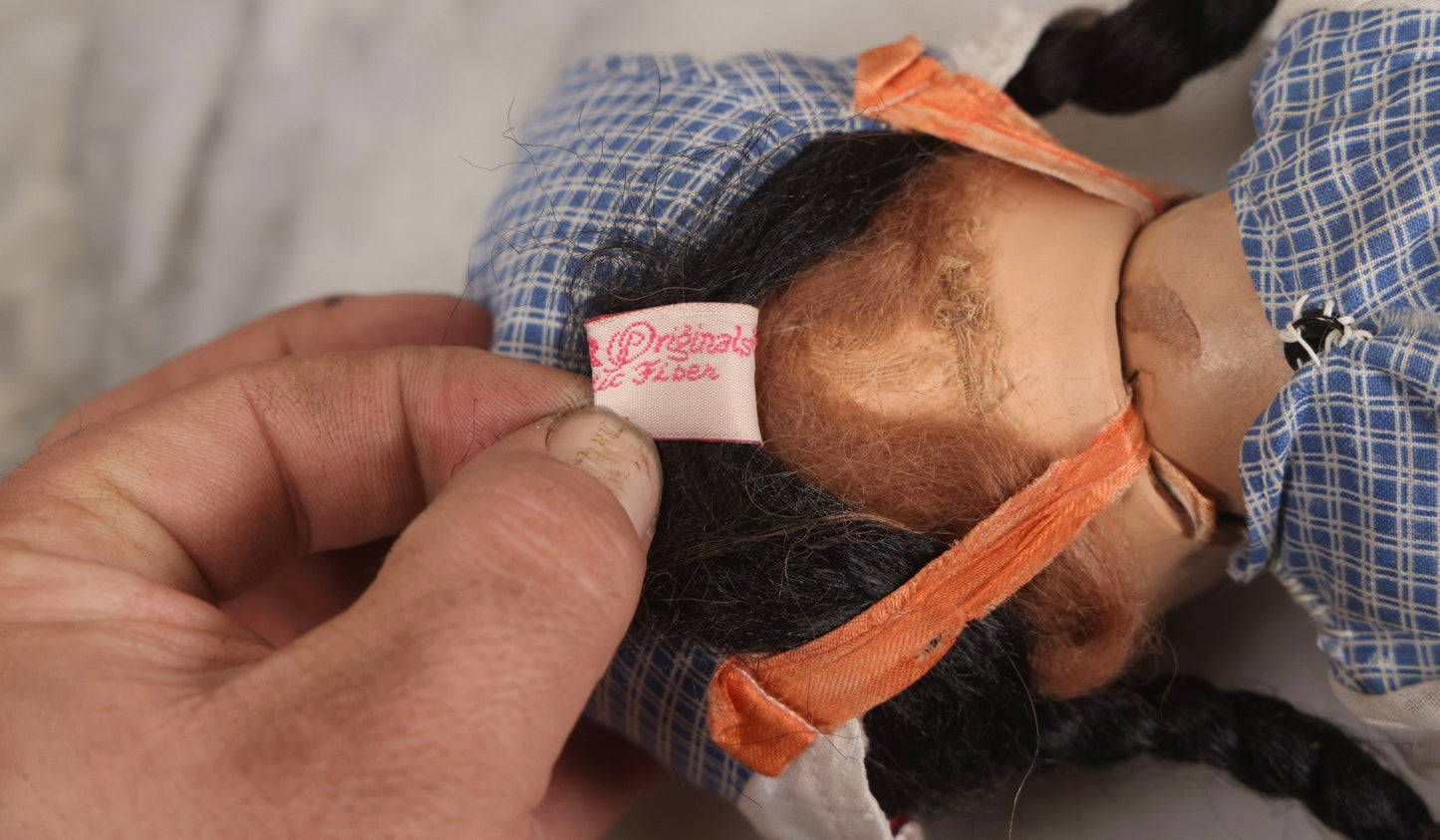 Lot 096 - Grouping Of Five Vintage Composition Dolls Including Floral Dress Doll, Plaid Dress Doll, Blue Check Dress Doll With Bonnet, Brown Composition Baby, And Small Jointed Doll