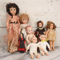 Lot 097 - Grouping Of Eight Vintage And Modern Plastic Dolls In Assorted Sizes And Outfits
