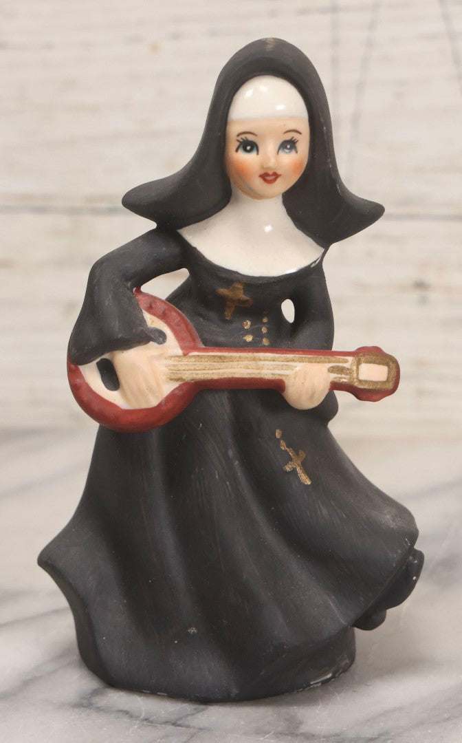 Lot 100 - Trio Of Vintage Porcelain And Ceramic Nun Items Including Music Box, M.J. Hummel Goebel Nun Bust (West Germany, 1978), And Banjo-Playing Nun Figurine