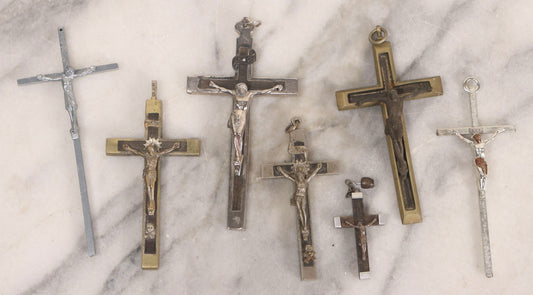 Lot 111 - Grouping Of Seven Vintage Crosses In Wood, Metal, And Plastic Including Two Golgotha Pectoral Crucifixes With Skull And Crossbones Motif