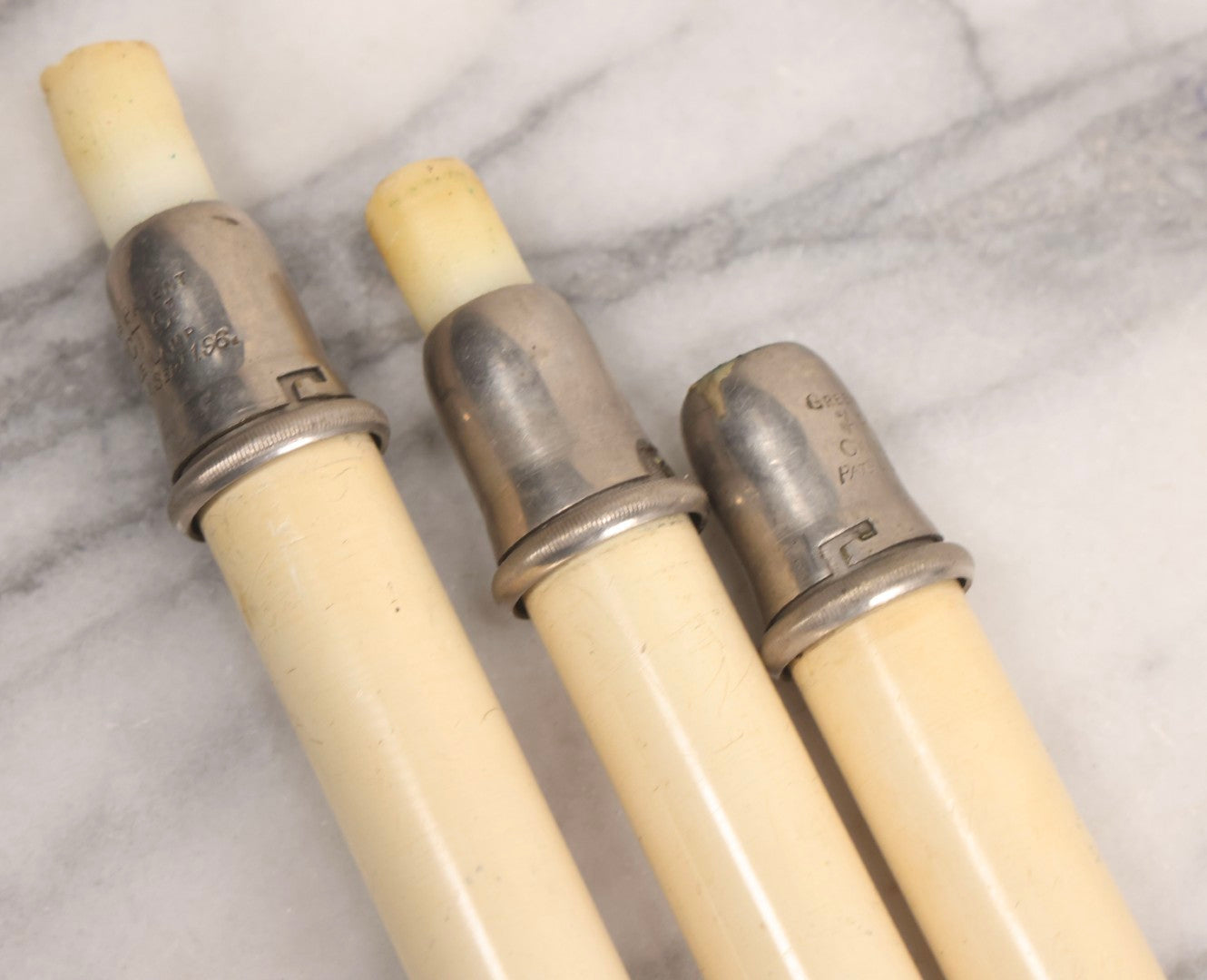 Lot 120 - Trio Of Antique Green's Patent "Arctic" Spring-Loaded Candle Lamp Holders