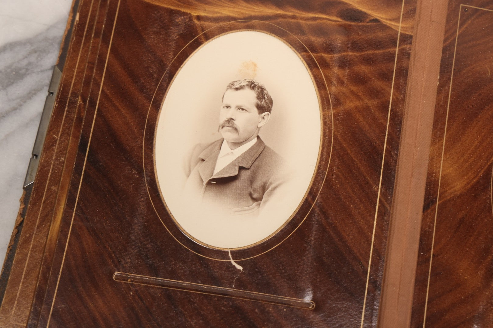 Lot 127 - Antique Brown Leather Covered Cabinet Card Family Photograph Album With 30+ Portrait Images Including Man In Fraternal Or Military Uniform, Men, Women, And Children, Note Binding Loose, Craft Grade