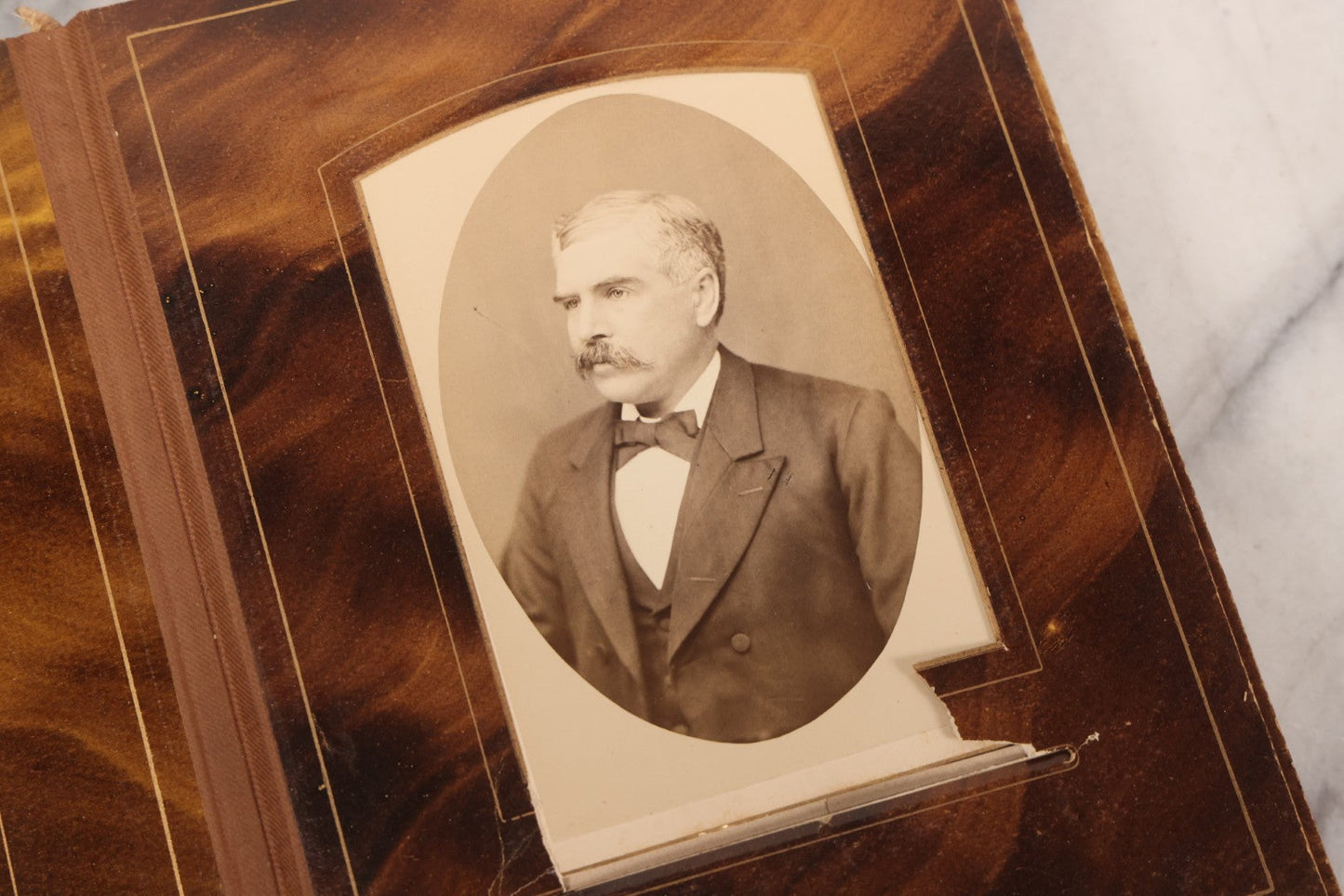 Lot 127 - Antique Brown Leather Covered Cabinet Card Family Photograph Album With 30+ Portrait Images Including Man In Fraternal Or Military Uniform, Men, Women, And Children, Note Binding Loose, Craft Grade