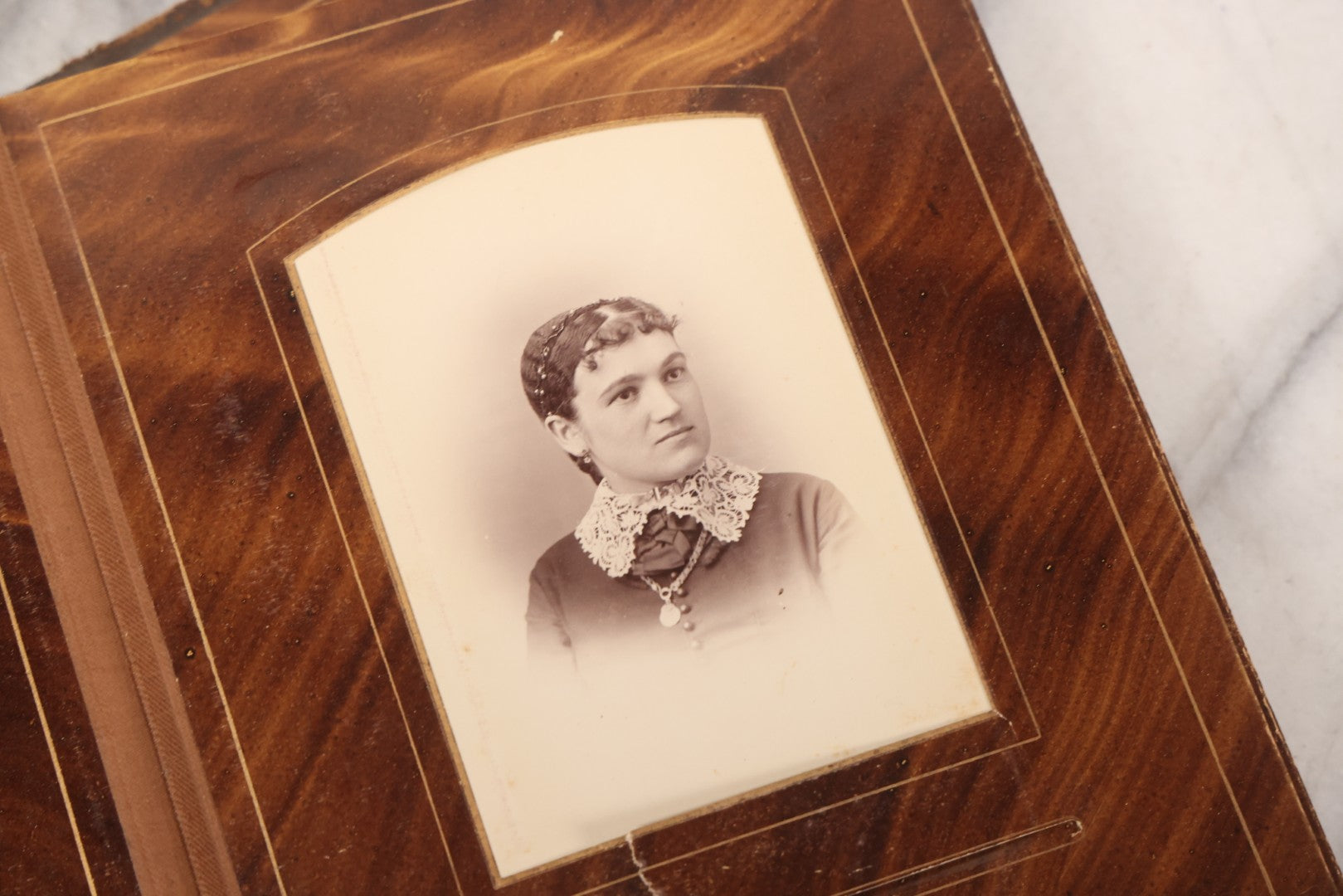 Lot 127 - Antique Brown Leather Covered Cabinet Card Family Photograph Album With 30+ Portrait Images Including Man In Fraternal Or Military Uniform, Men, Women, And Children, Note Binding Loose, Craft Grade