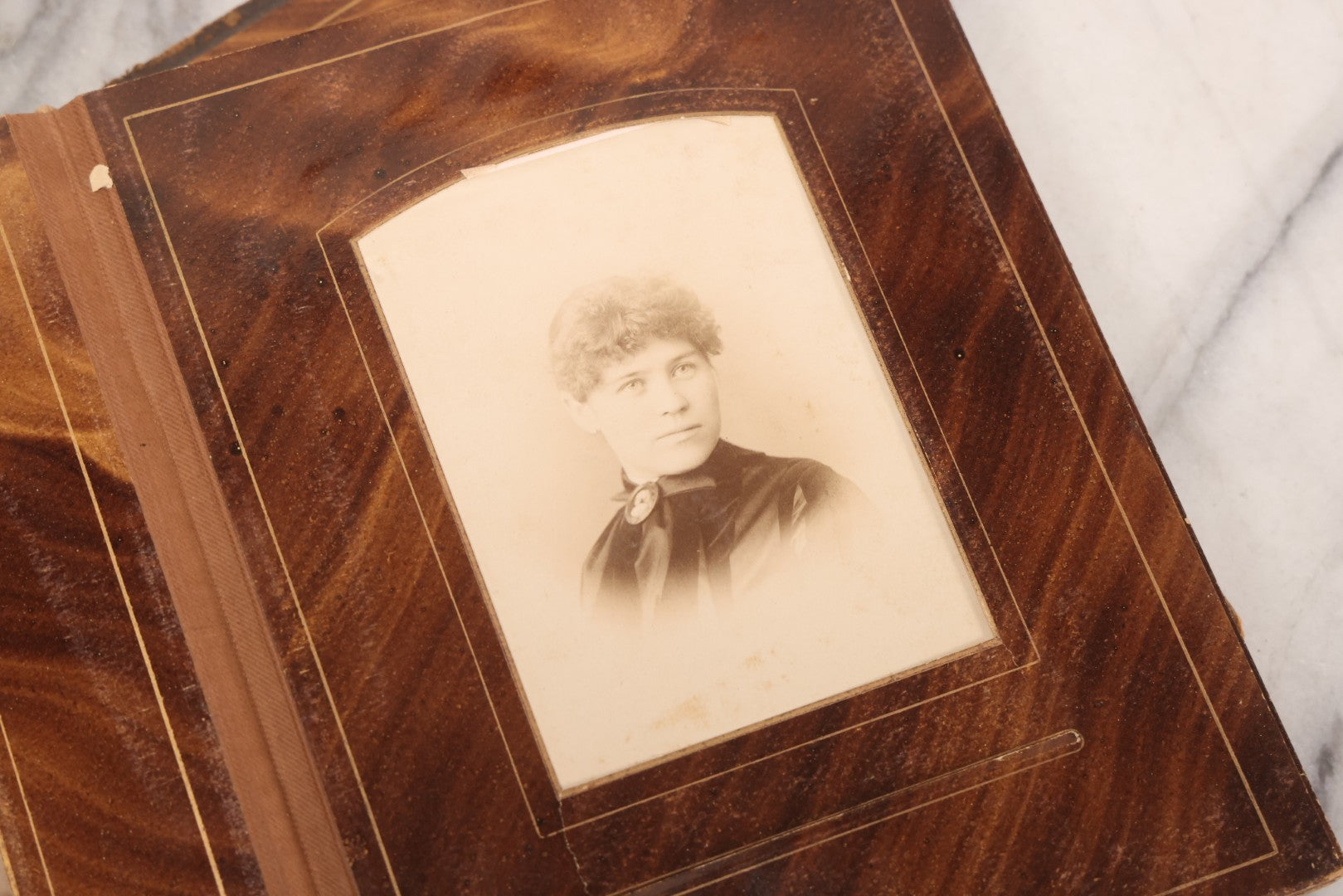 Lot 127 - Antique Brown Leather Covered Cabinet Card Family Photograph Album With 30+ Portrait Images Including Man In Fraternal Or Military Uniform, Men, Women, And Children, Note Binding Loose, Craft Grade