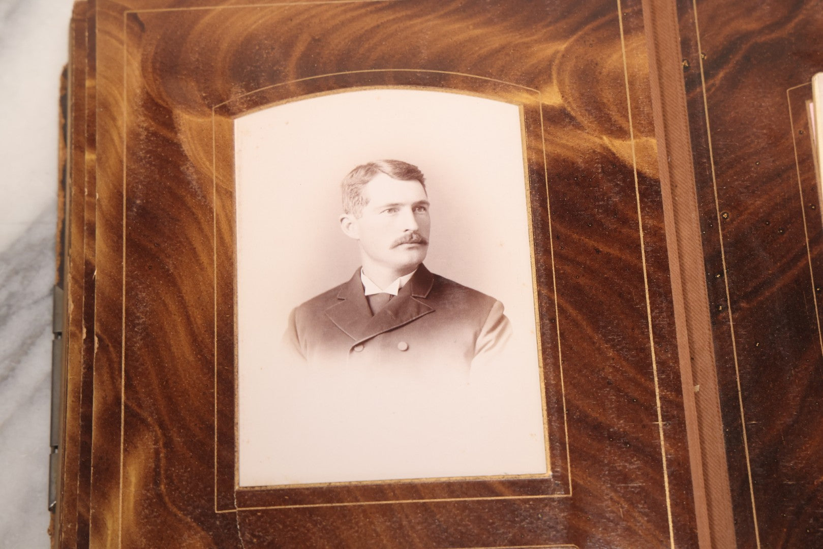 Lot 127 - Antique Brown Leather Covered Cabinet Card Family Photograph Album With 30+ Portrait Images Including Man In Fraternal Or Military Uniform, Men, Women, And Children, Note Binding Loose, Craft Grade
