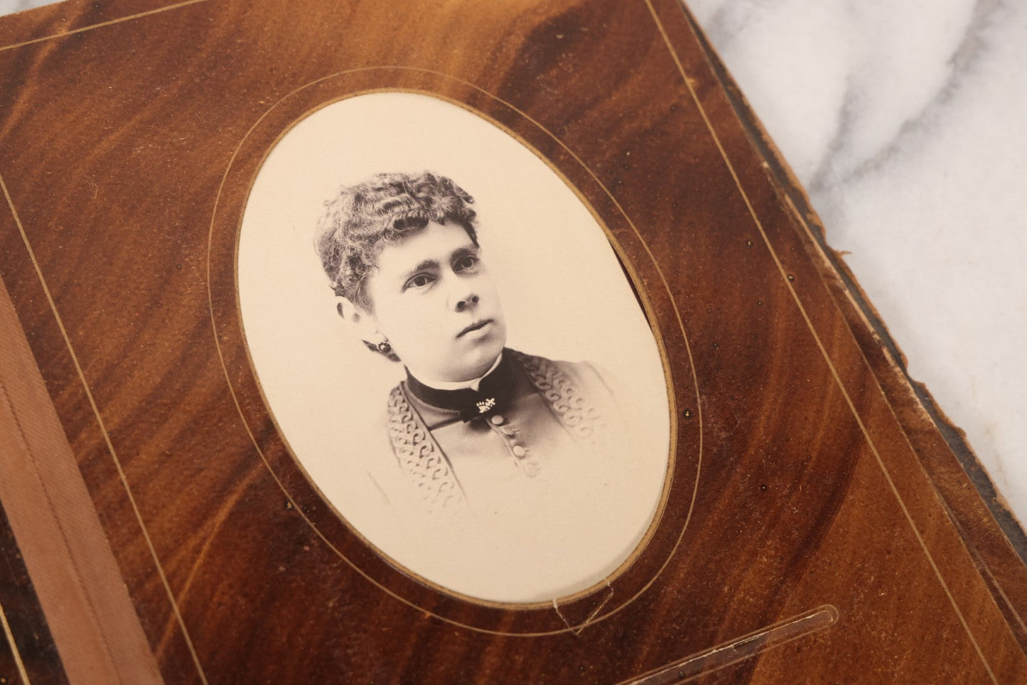 Lot 127 - Antique Brown Leather Covered Cabinet Card Family Photograph Album With 30+ Portrait Images Including Man In Fraternal Or Military Uniform, Men, Women, And Children, Note Binding Loose, Craft Grade