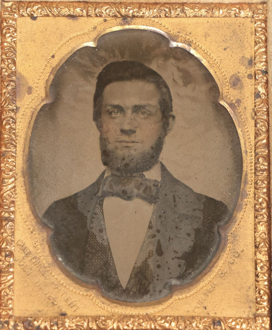 Lot 131 - Antique 1/9th Plate Ambrotype Photograph Of Young Bearded Man With Bowtie In Case With Cutting's Patent Brass Mat, Photographed By Porter & Co.