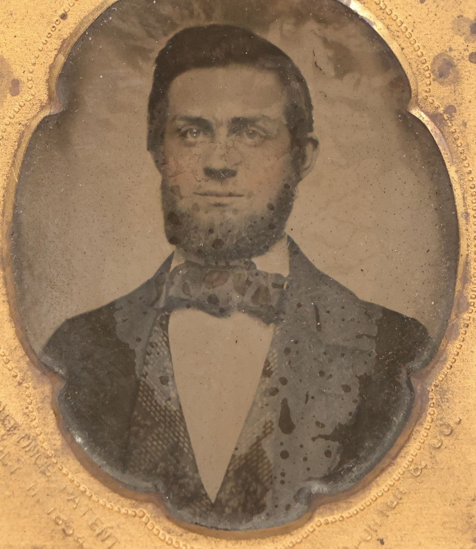 Lot 131 - Antique 1/9th Plate Ambrotype Photograph Of Young Bearded Man With Bowtie In Case With Cutting's Patent Brass Mat, Photographed By Porter & Co.