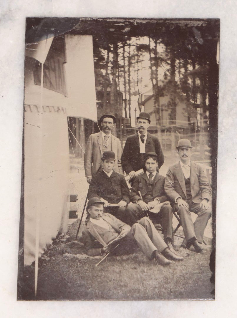 Lot 138 - Antique Uncased Tintype Photograph Of Group Of Men Posed Outdoors With Banner And Cabin
