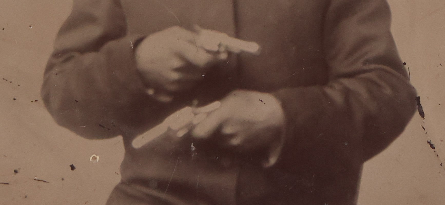 Lot 142 - Antique Late 19th Century Tintype Photograph Of Seated Man Holding Two Pistols, Uncased