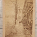 Lot 150 - Antique Boudoir-Sized Cabinet Card Photograph Depicting Street Scene Aftermath Of Great Blizzard Of 1888, New York City, With Snow Banks, Pedestrians, And "Butterick's Patterns" Storefront Visible