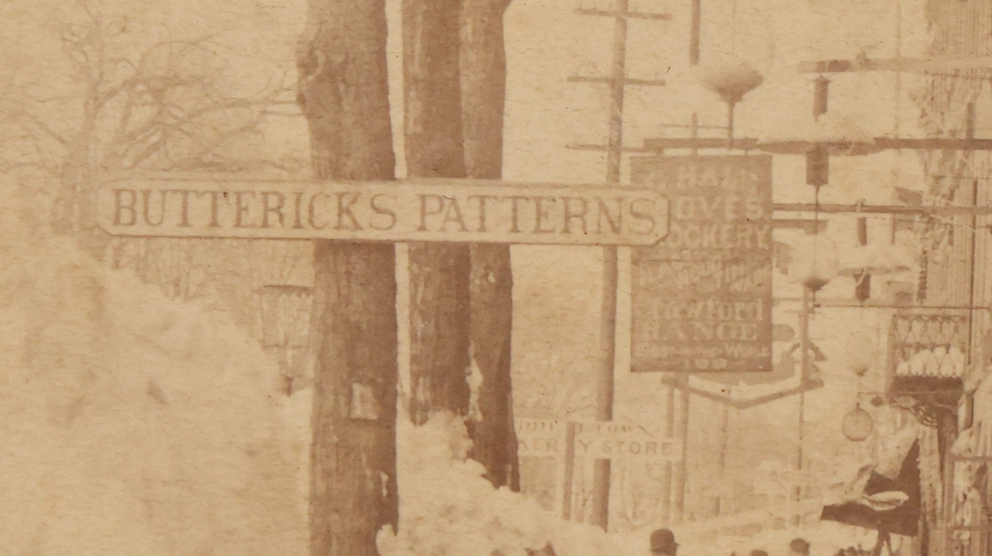 Lot 150 - Antique Boudoir-Sized Cabinet Card Photograph Depicting Street Scene Aftermath Of Great Blizzard Of 1888, New York City, With Snow Banks, Pedestrians, And "Butterick's Patterns" Storefront Visible