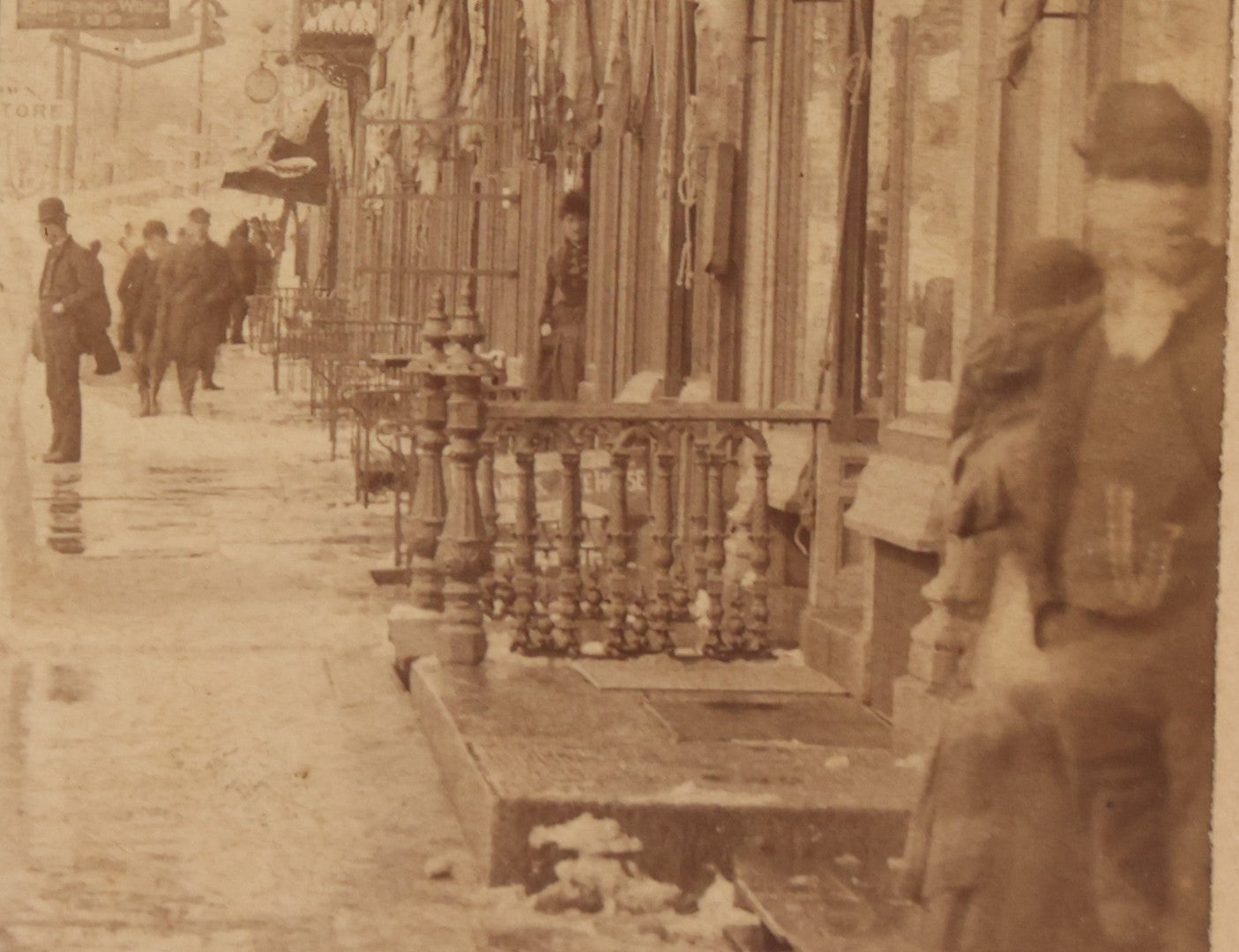 Lot 150 - Antique Boudoir-Sized Cabinet Card Photograph Depicting Street Scene Aftermath Of Great Blizzard Of 1888, New York City, With Snow Banks, Pedestrians, And "Butterick's Patterns" Storefront Visible