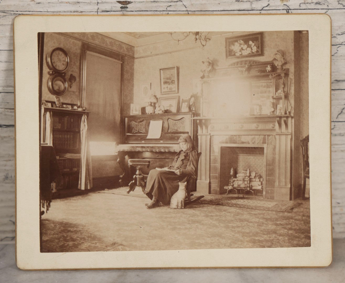 Lot 163 - Antique Boarded Interior Photograph Of Girl Identified As Ella In “Music Room” With Toy Cat, Dated April 30, 1893