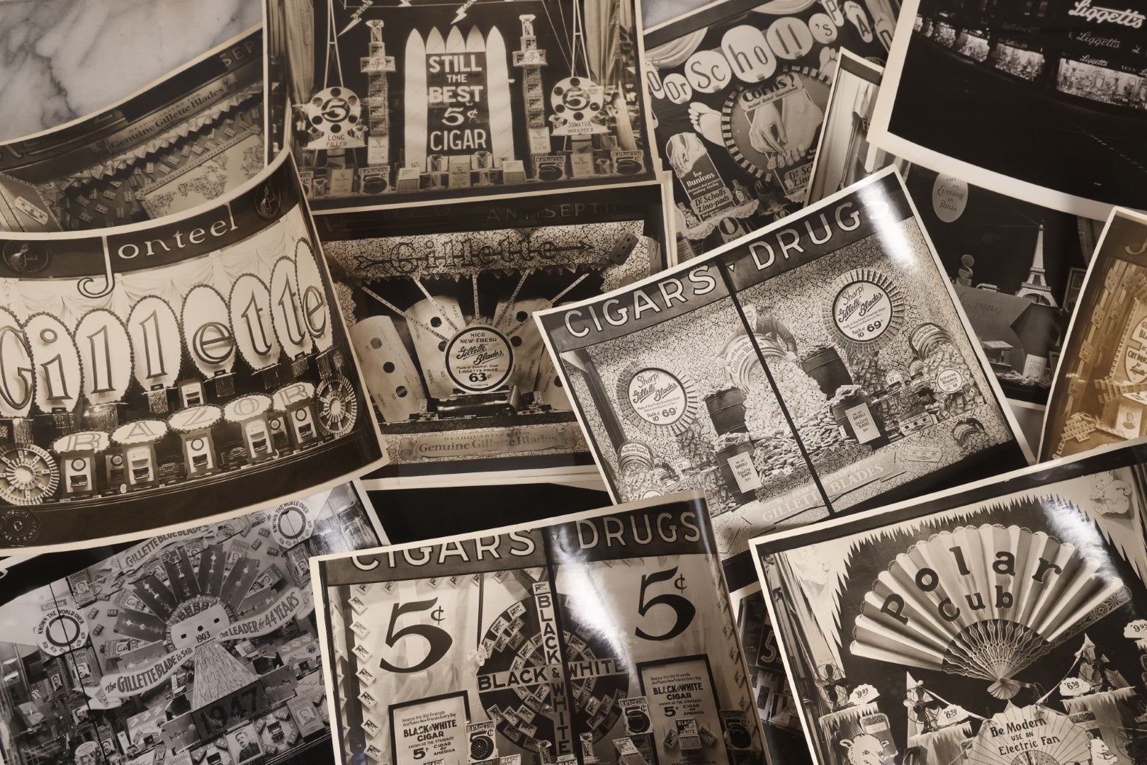 Lot 167 - Grouping Of 17 Glossy Unmounted Photographs Of Liggett's Rexall Store Window Advertising Displays, Circa 1940s