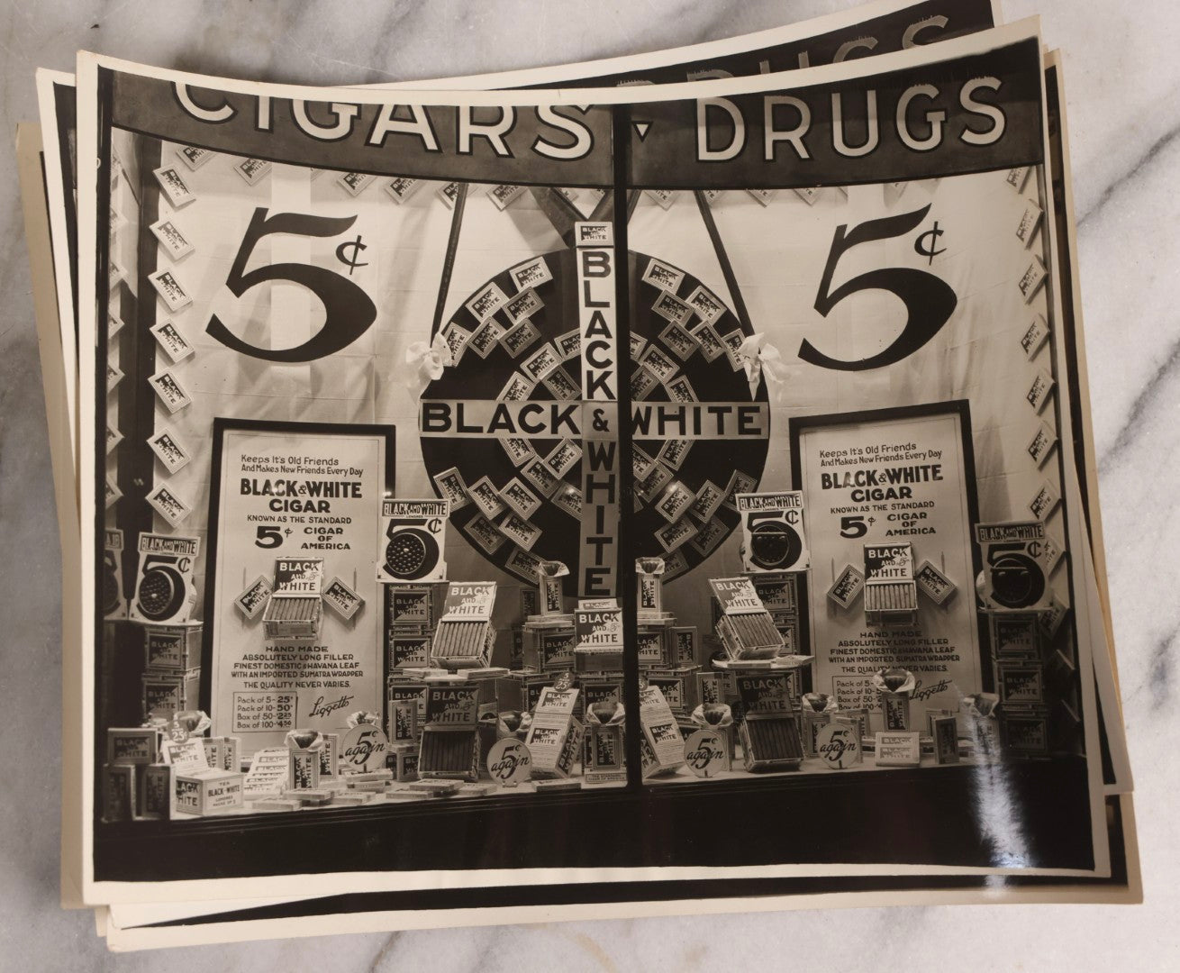 Lot 167 - Grouping Of 17 Glossy Unmounted Photographs Of Liggett's Rexall Store Window Advertising Displays, Circa 1940s