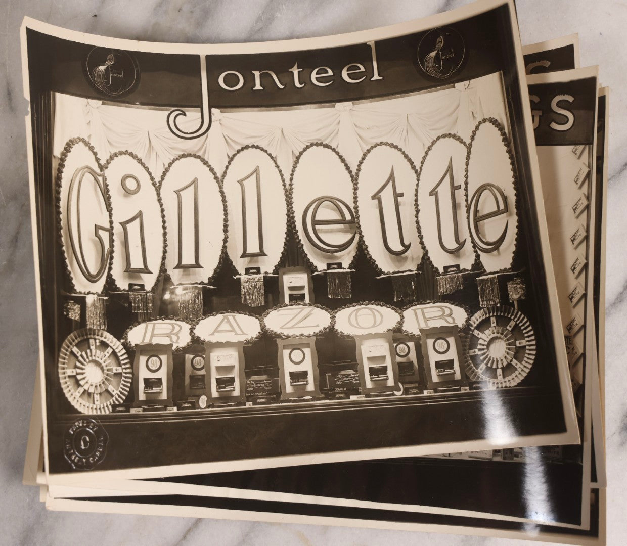 Lot 167 - Grouping Of 17 Glossy Unmounted Photographs Of Liggett's Rexall Store Window Advertising Displays, Circa 1940s