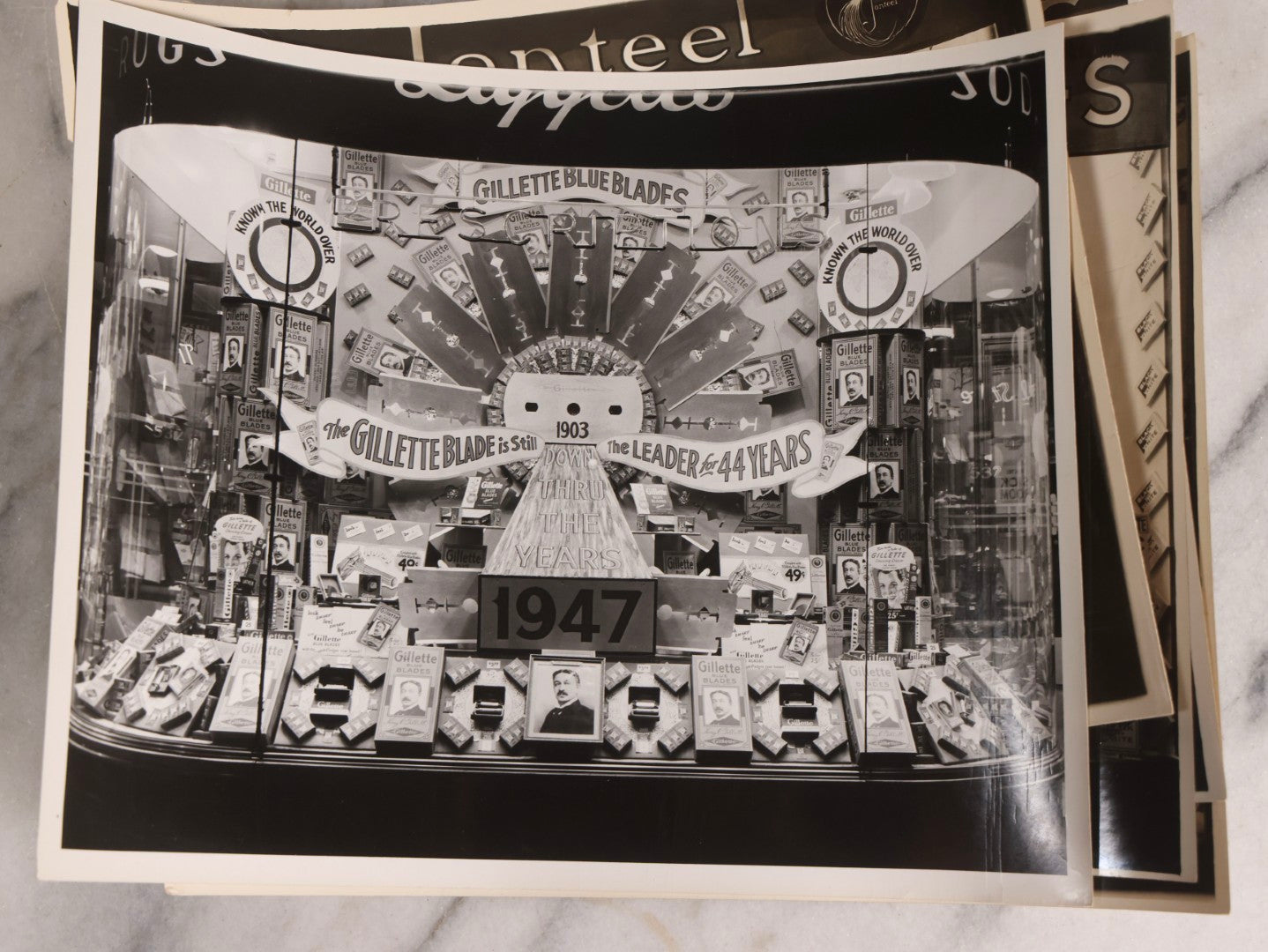 Lot 167 - Grouping Of 17 Glossy Unmounted Photographs Of Liggett's Rexall Store Window Advertising Displays, Circa 1940s