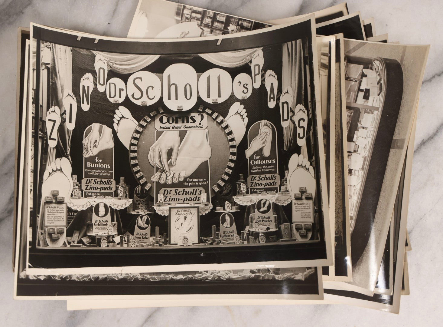 Lot 167 - Grouping Of 17 Glossy Unmounted Photographs Of Liggett's Rexall Store Window Advertising Displays, Circa 1940s