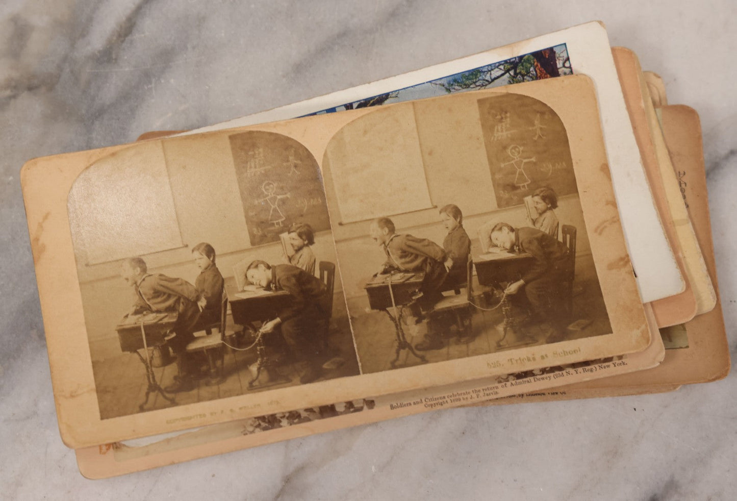 Lot 171 - Grouping Of 13 Antique Photographic Stereo View Cards Depicting Rock Of Ages, Comic Staged Scenes, Admiral Dewey Parade, Interior And Exterior Architecture, And Art