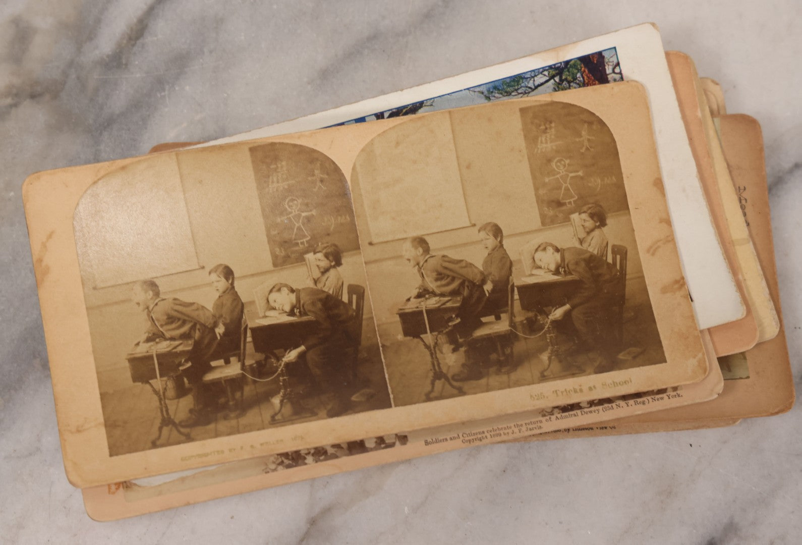 Lot 171 - Grouping Of 13 Antique Photographic Stereo View Cards Depicting Rock Of Ages, Comic Staged Scenes, Admiral Dewey Parade, Interior And Exterior Architecture, And Art