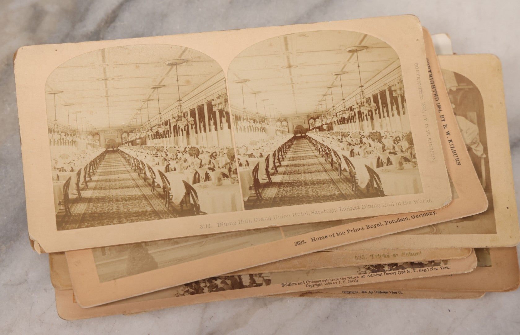 Lot 171 - Grouping Of 13 Antique Photographic Stereo View Cards Depicting Rock Of Ages, Comic Staged Scenes, Admiral Dewey Parade, Interior And Exterior Architecture, And Art