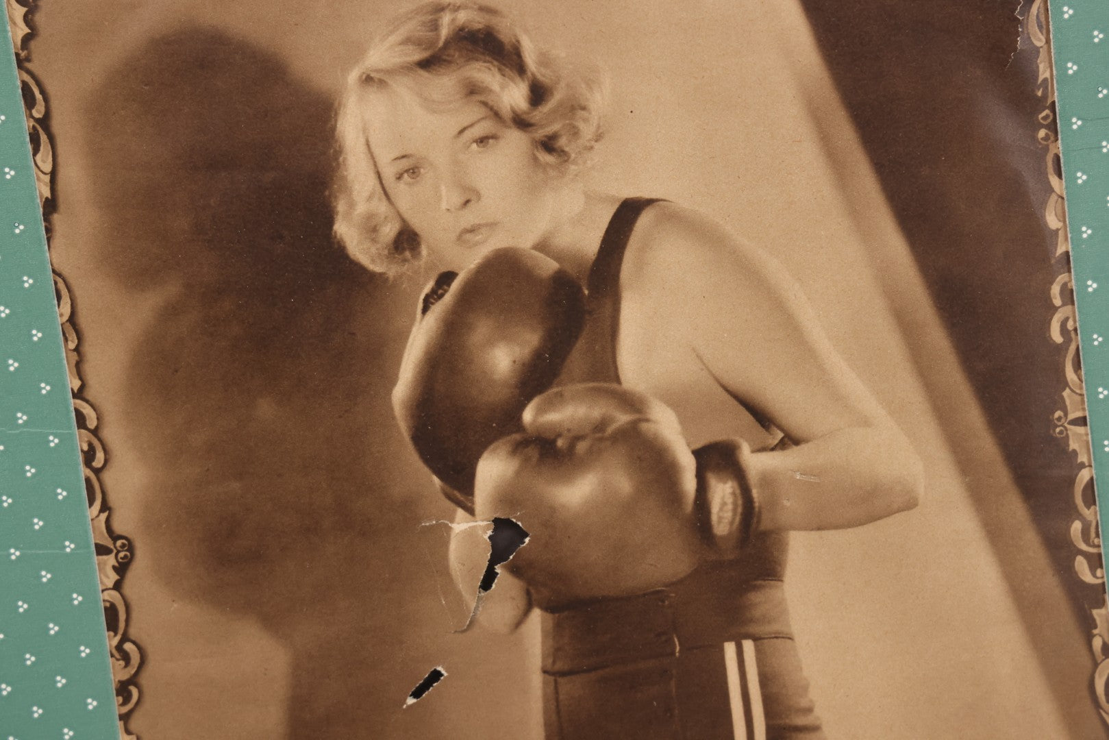 Lot 173 - Vintage Black And White Photograph Of Female Boxer Dorothy Mackaill In Blue Patterned Paper Frame, Likely Promotional Photo, Handwritten Pencil Identification On Verso, Note Small Tears And Holes Center Of Photo
