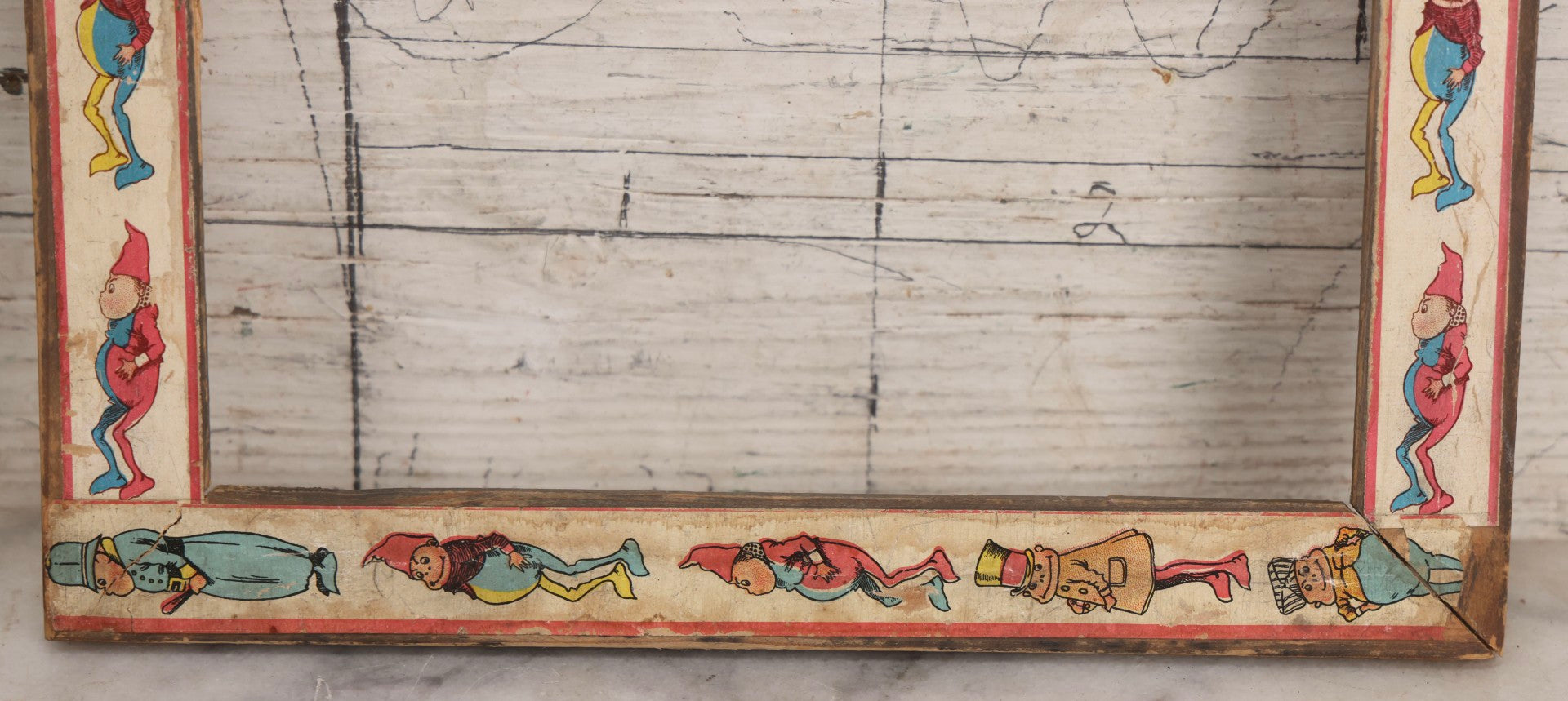 Lot 180 - Antique Wooden Picture Frame With Applied Lithographed Paper Border Featuring Palmer Cox Brownies Illustrations