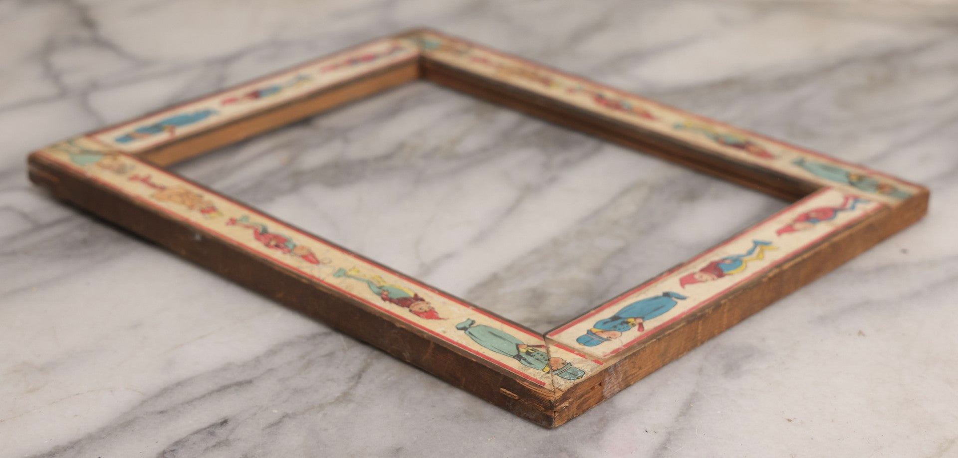 Lot 180 - Antique Wooden Picture Frame With Applied Lithographed Paper Border Featuring Palmer Cox Brownies Illustrations