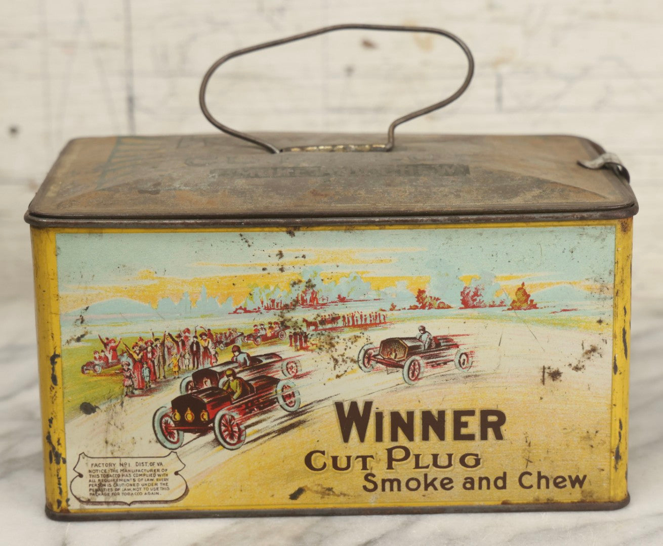 Lot 188 - Antique Tin Lithograph "Winner Cut Plug Smoke And Chew" Tobacco Tin With Auto Racing Motif, J. Wright Co., Richmond, Virginia, Circa 1910–1920