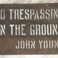 Lot 204 - Antique Brass Stencil Reading “No Trespassing On The Ground — John Young,” 14-3/4" x 9-3/4"