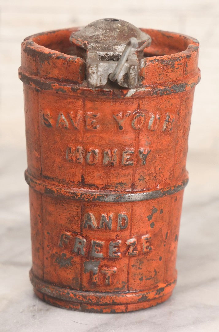 Lot 207 - Vintage Cast Iron Ice Cream Churn-Form Still Bank With “Save Your Money And Freeze It” Slogan, Orange Paint